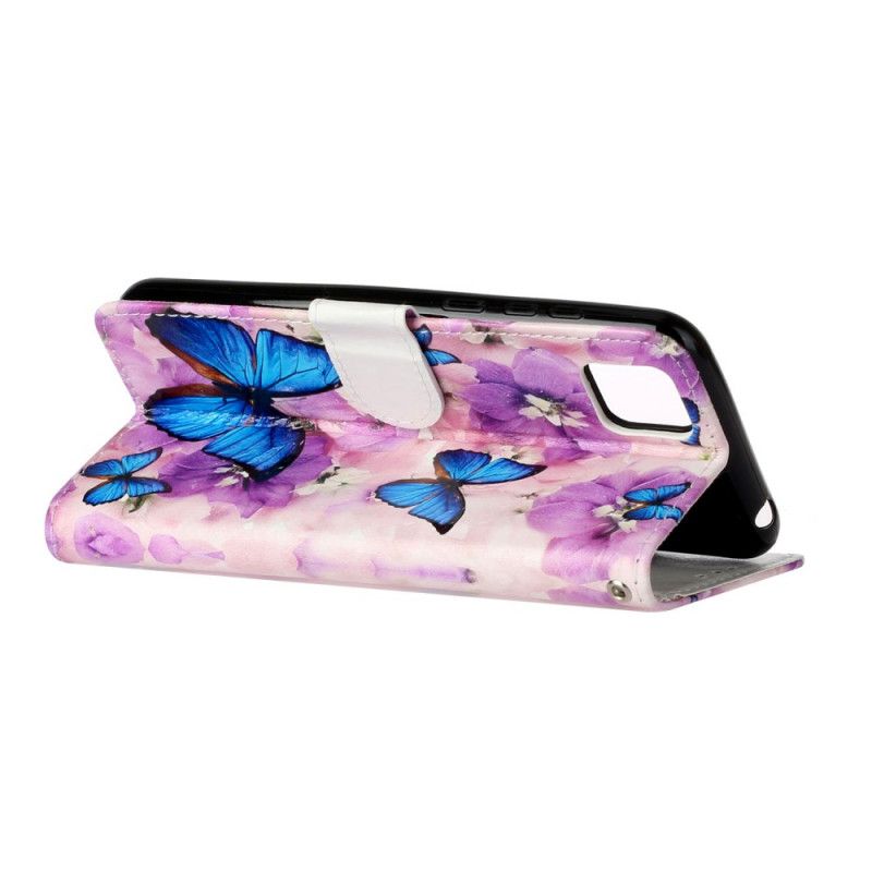 Flip Cover Huawei Y5p Mobilcover Blå Sommerfugle I Blomsterne